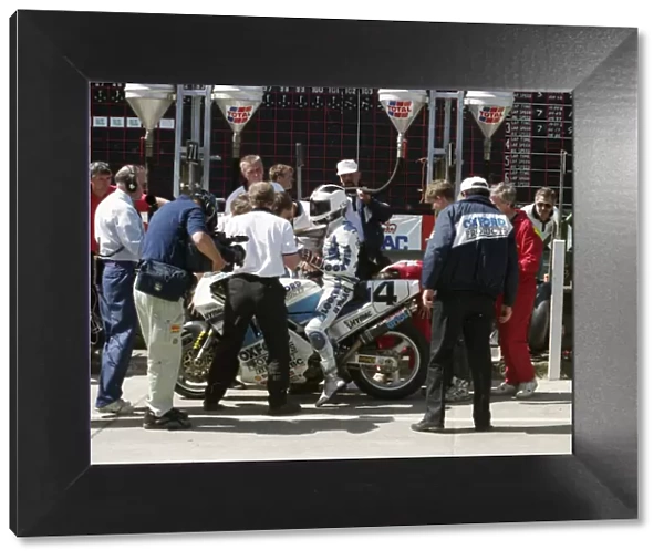 Pit stop action for Robert Dunlop (Oxford Ducati) 1993 Formula One TT