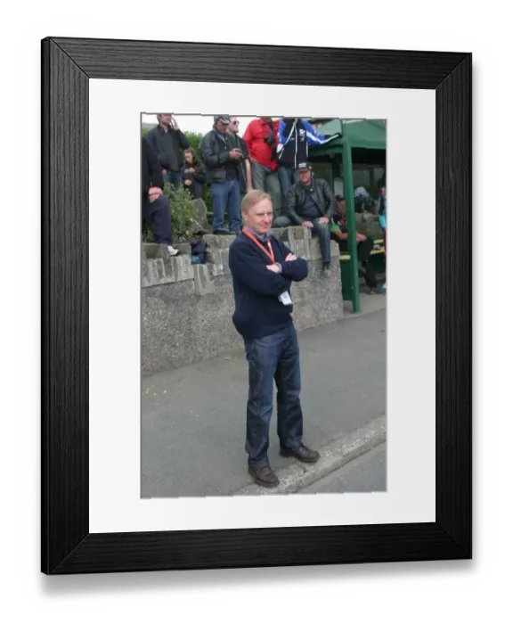 Framed Print : Brian Reid watches the 2010 TT Parade Framed Print : Brian Reid watches the 2010 TT Parade