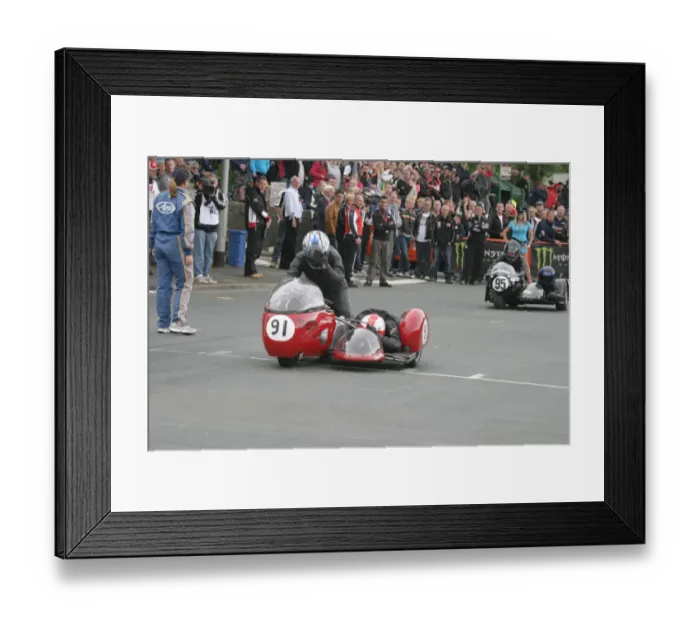 Framed Print : Grahame Alcock & Kerry Williams (Triumph / Norton) 2010 TT Parade Lap Framed Print : Grahame Alcock & Kerry Williams (Triumph / Norton) 2010 TT Parade Lap