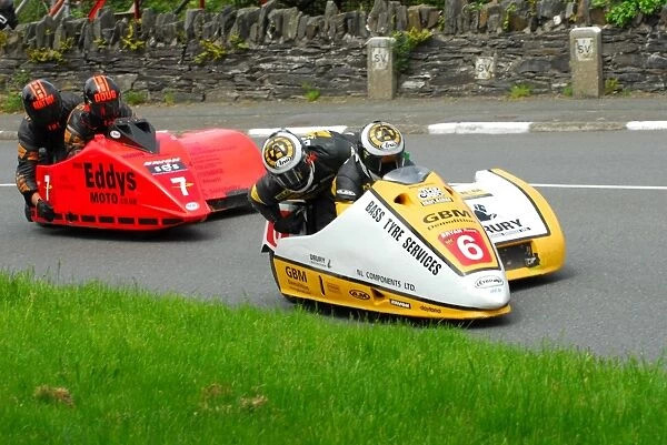 Gary Bryan & Jamie Winn (Baker Honda) and Douglas Wright & Martin Hull (Baker) 2013 Sidecar TT