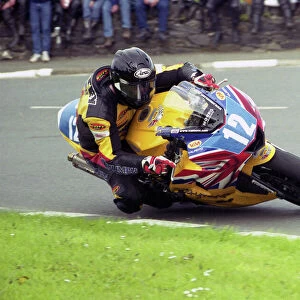 Bruce Anstey (Triumph) at Sulby Bridge, 2003 Junior TT