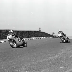 Irish ace Tommy Robb & Australian Tom Phillis (Honda) at Signpost Corner; 1962 Ultra Lightweight Junior TT Irish ace Tommy Robb & Australian Tom Phillis (Honda) at Signpost Corner; 1962 Ultra Lightweight Junior TT