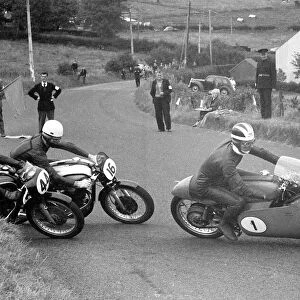 Bill Lomas (Guzzi) and John Hartle (Norton, 11) 1956 Junior Ulster Grand Prix