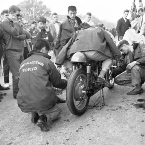 Nobby Clark fettles Jim Redmans Honda 6 1965 Lightweight TT