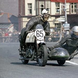 Peter Gerrish and P W Sharp (Vincent) leaves Parliament Square; 1967 Sidecar TT