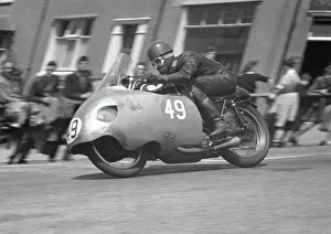 Images Dated 2nd August 2011: Dennis Christian on Bray Hill: 1957 Senior TT