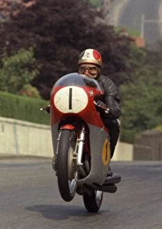 MV Gallery: Giacomo Agostini (MV) on Agos Leap. Quarter Bridge Road, 1970 Senior TT
