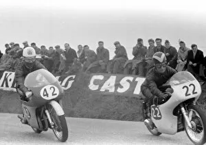 Images Dated 25th December 2021: John Hartle (MV) overtakes Arthur Wheeler (AJS) 1958 Senior TT