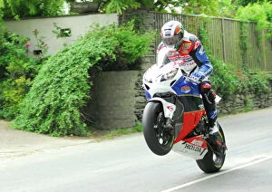Images Dated 2nd June 2012: John McGuinness flies Ballacrye; 2012 Superbike TT