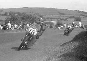 Images Dated 17th December 2021: Mike Hailwood (Ducati) and Gary Hocking (MZ) 1959 Lightweight Ulster Grand Prix