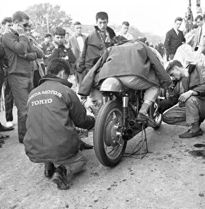 Nobby Clark fettles Jim Redmans Honda 6 1965 Lightweight TT