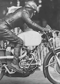 Omobono Tenni Collection: Omobono Tenni (Guzzi) flies Ballaugh Bridge